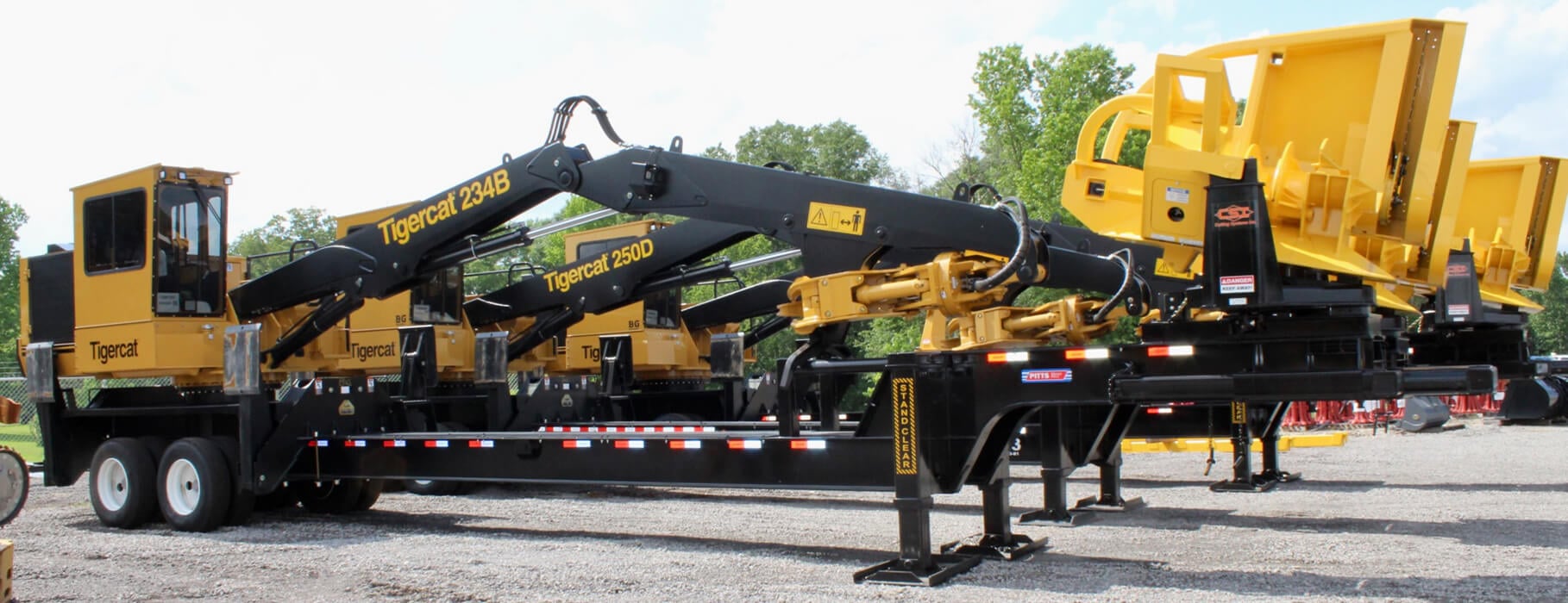 Lineup of Tigercat Log Loader Trailers